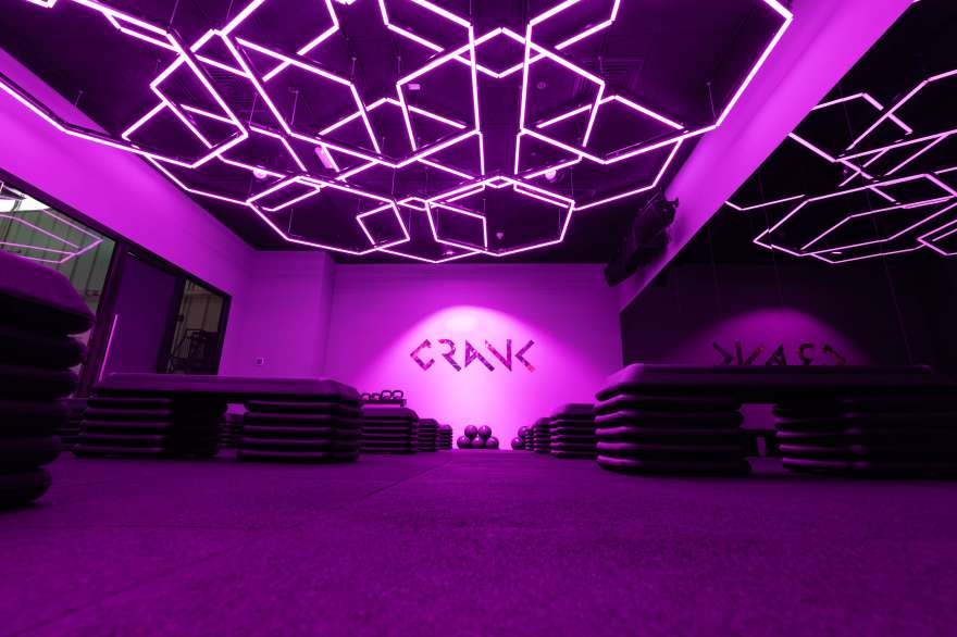 Crank Gym uplifts their members' workout experience with Madrix and Cyclops Lighting